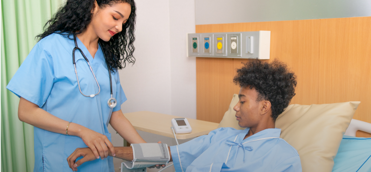 nurse checking blood pressure